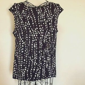 Black & white motif print, capped sleeved blouse, asymmetrical gather at buckle.